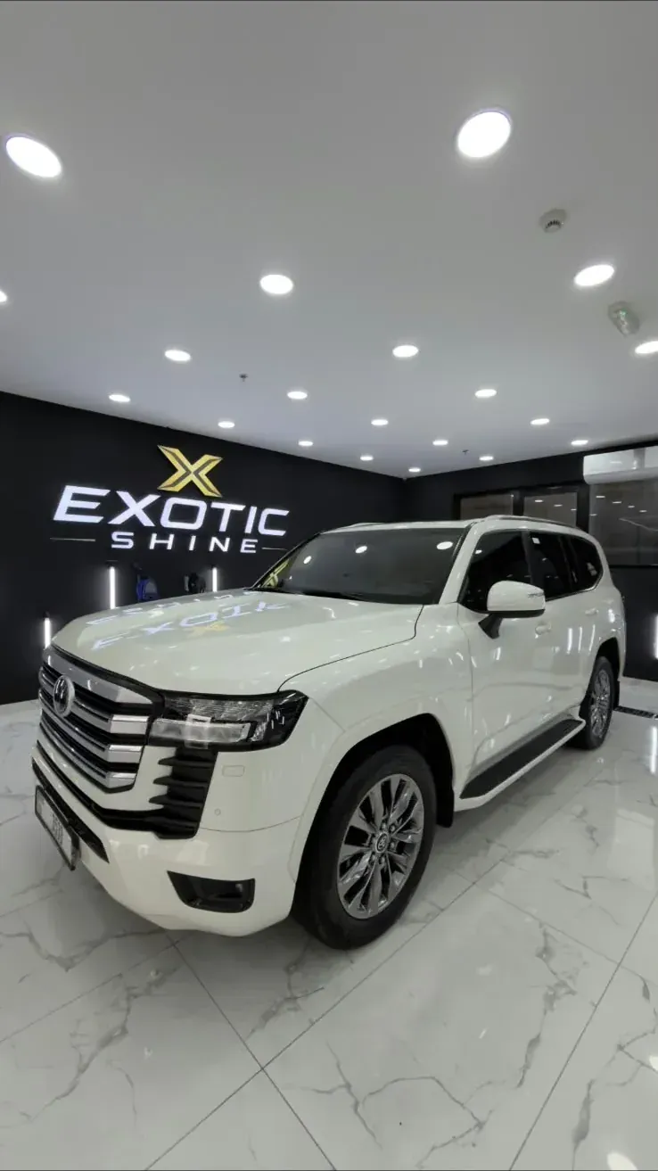 A white Land Cruiser in the workshop